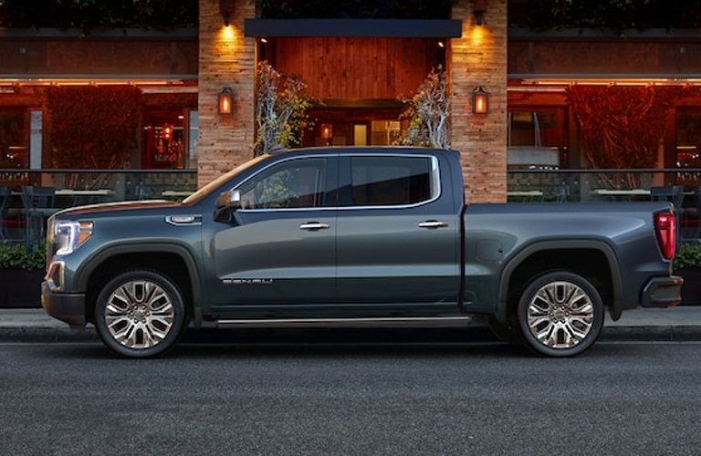 Exterior view of a gray 2019 GMC Sierra 1500 parked on a city street