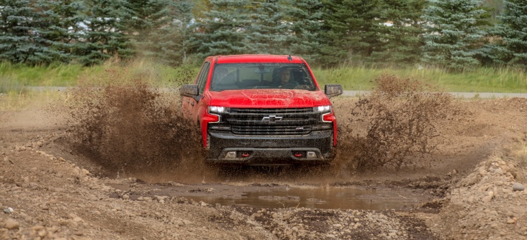 2019 Chevy Silverado red in the mud front view