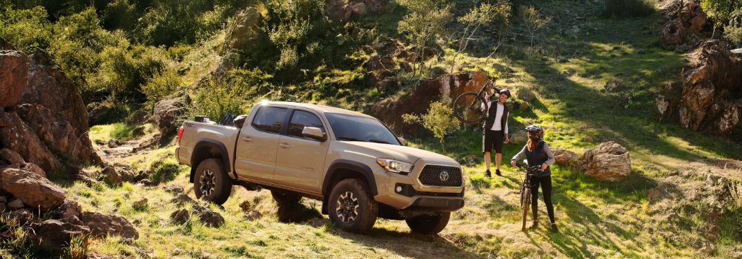 2019 Toyota Tacoma TRD Performance Specs with image of 2019 Tacoma TRD Off-Road in valley with bikers